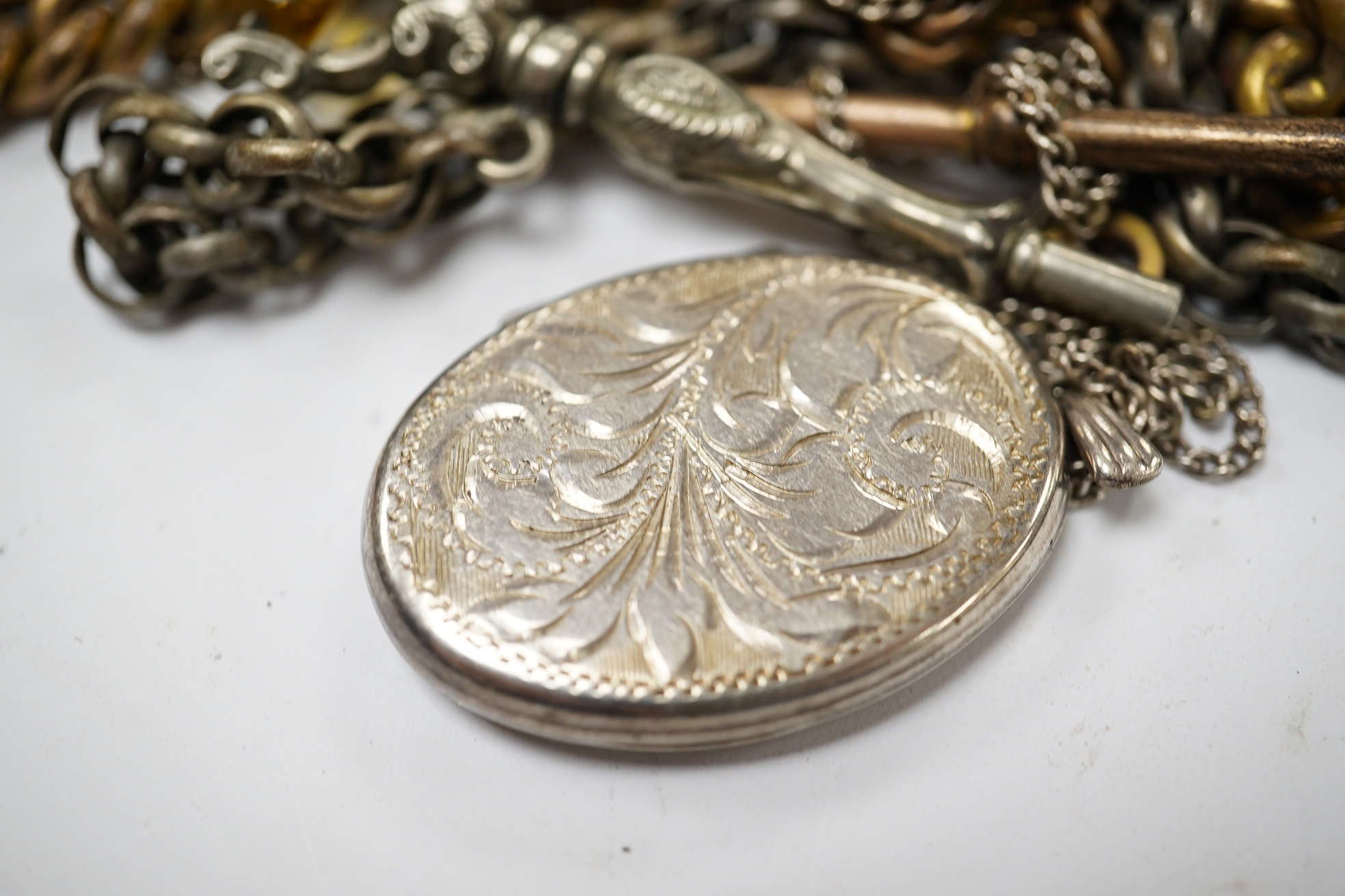 A cased Australian? yellow and white metal 'spade and nugget' brooch, 54mm and sundry other jewellery including albert and silver locket. Condition - poor to fair